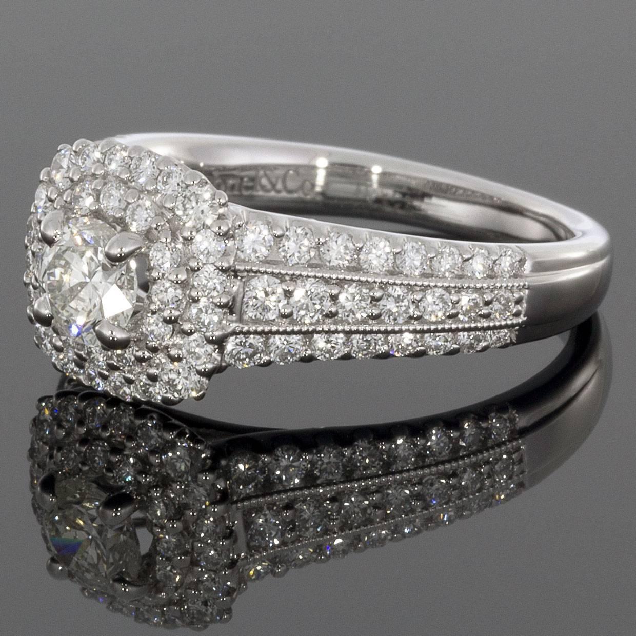 This classically styled band would make a wonderful engagement or anniversary ring. The ring is comprised of 14 karat white gold & features round brilliant cut diamonds that have a combined total weight of 1.45 carats. The center diamond is I/I1 in