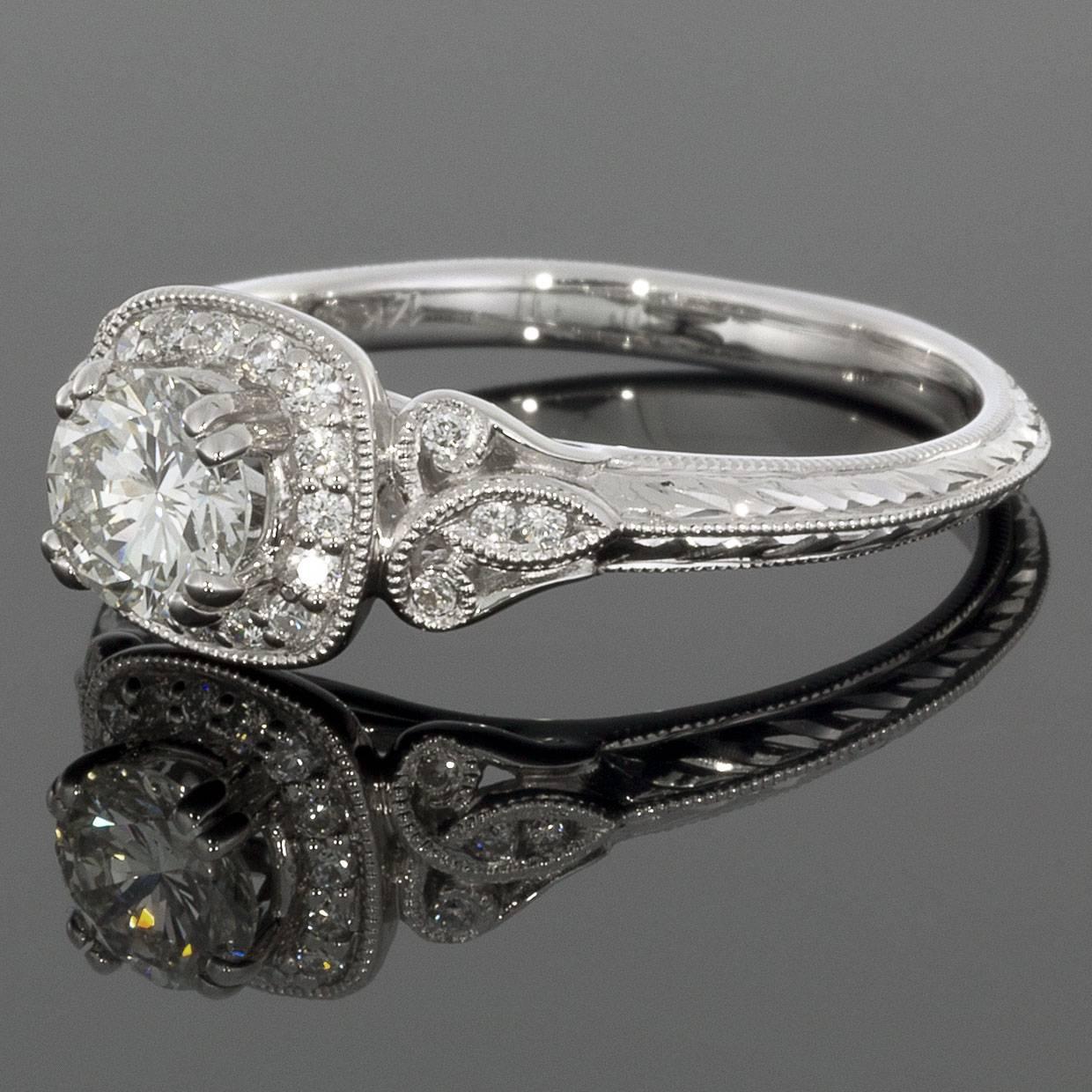 This classically styled band would make a wonderful engagement or anniversary ring. The ring is comprised of 14 karat white gold & features round brilliant cut diamonds that have a combined total weight of 1.17 carats. The diamonds are I/VS2 in