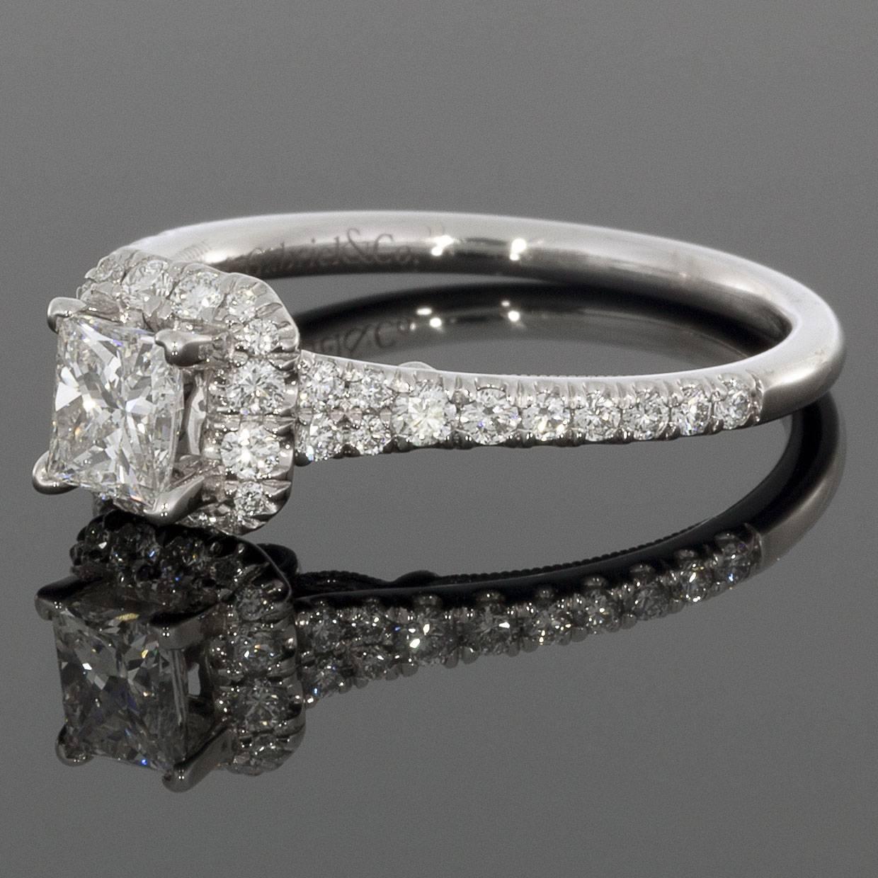 The diamonds are H/SI1 in quality. The ring is a finger size 6.5. Don't miss this gorgeous ring for a fraction of retail! MSRP $3000! 

Details:
Princess Cut Center Diamond
Halo 14k White Gold Setting
.47ct Center Diamond
.86 Total Diamond