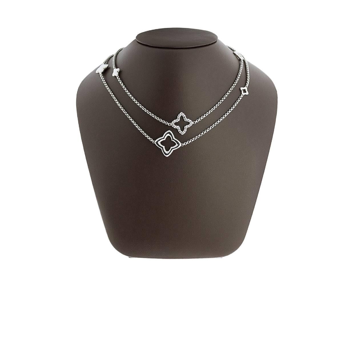 This beautiful chain necklace features Yurman's signature cable design and quatrefoil pendants. This necklace is made of sterling silver and is 36