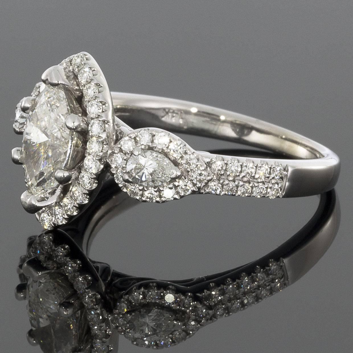 Marquise brilliant cut diamonds are a great option if you are looking for something unique that maximizes carat weight & elongates the finger. The center diamond in this beautiful engagement ring is a .82 carat marquise shape. The center diamond