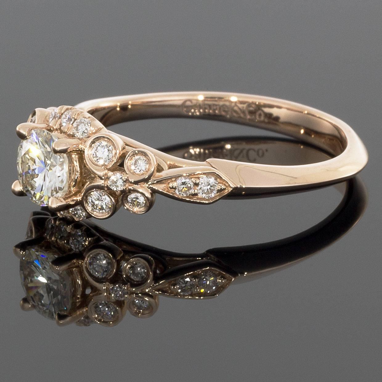 This vintage style 14K rose gold engagement ring features a 0.42CT round center diamond and 0.62CTW diamond accents. This beautiful ring will arrive in a beautiful presentation box. 