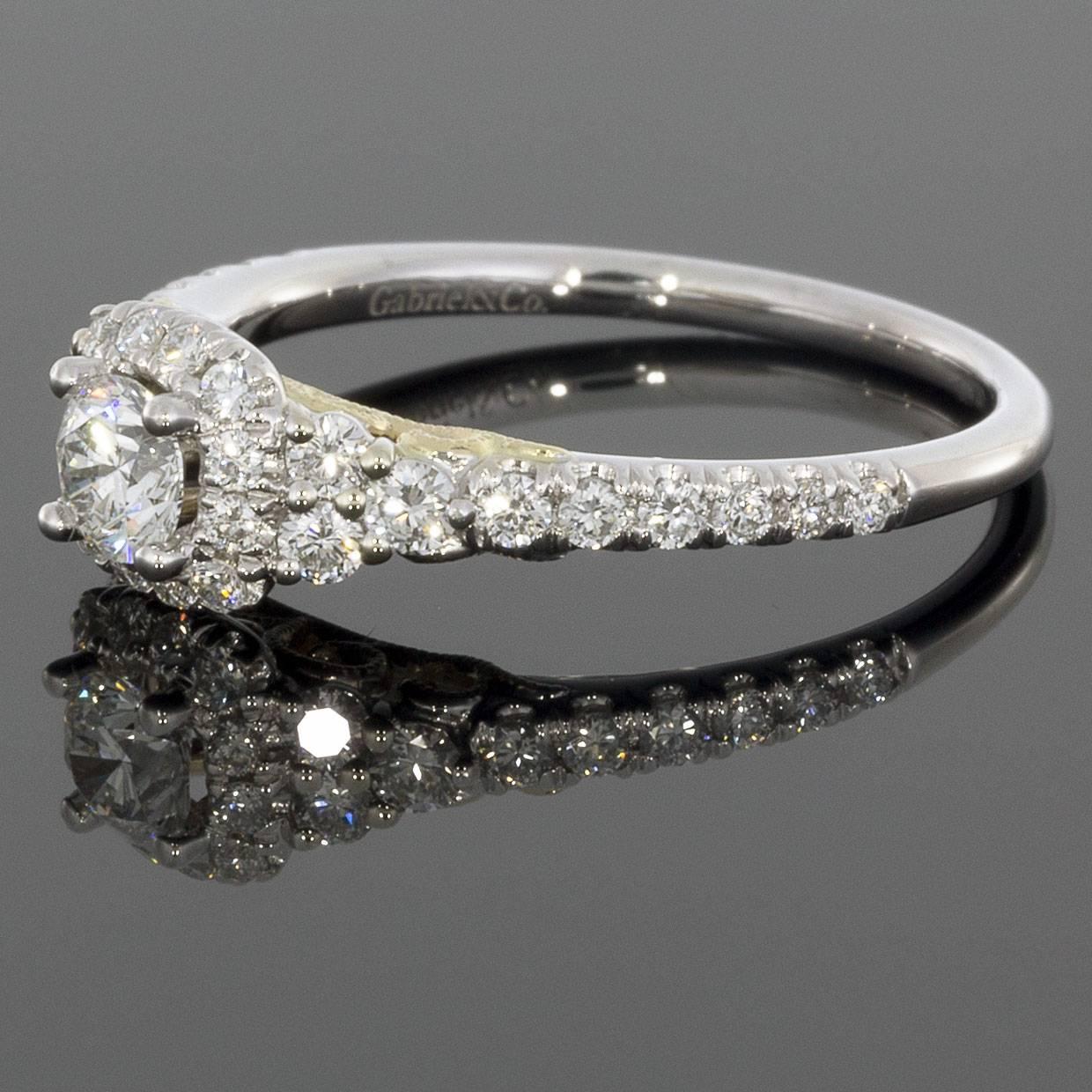 Details:
14K white gold with 14K yellow gold gallery accent
0.24CT Round center diamond
0.70CTW round accent diamonds
Finger size 6.5 
Comes in a beautiful presentation box
An adult signature will be required for delivery unless other arrangements