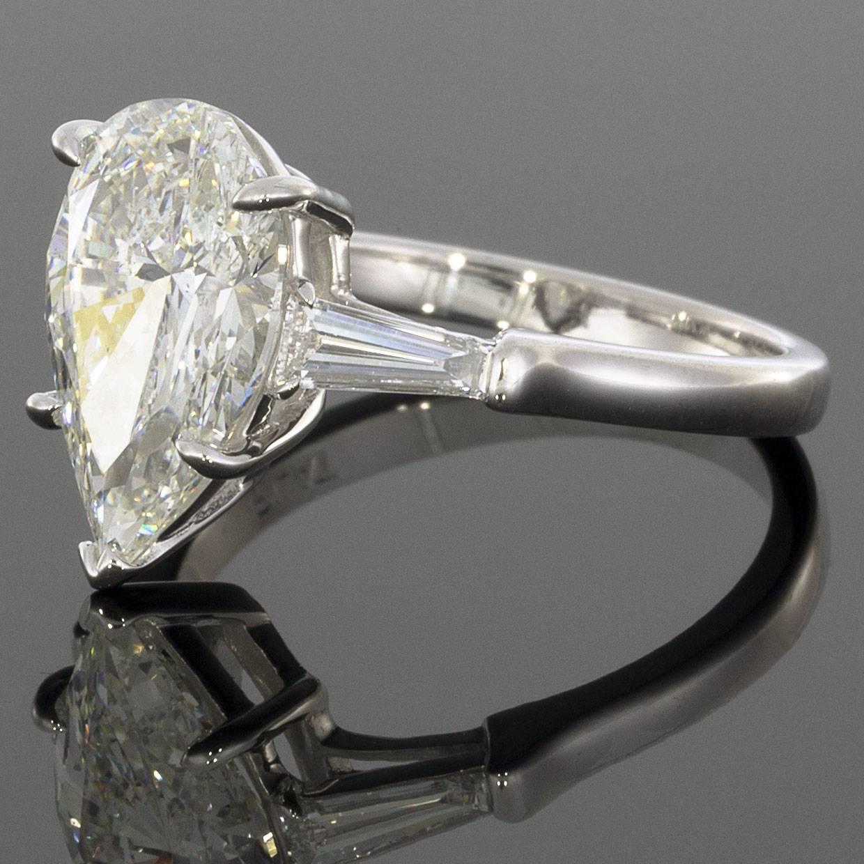 Details:
Platinum setting
3.02CT G/SI1 Pear center diamond 
0.34CTW Baguette accent diamonds
Finger size 6.5
Reg. $50,000
Comes in a beautiful presentation box
An adult signature will be required for delivery unless other arrangements are made prior