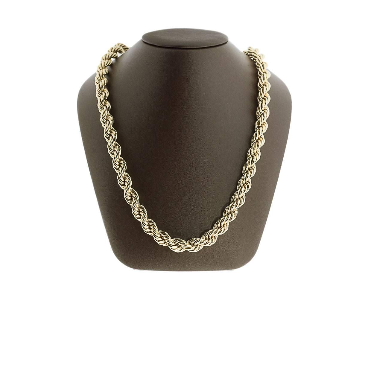This lovely necklace offers a classy & timeless look. This necklace is made of solid 14 karat yellow gold and features a braided design. It measures 28