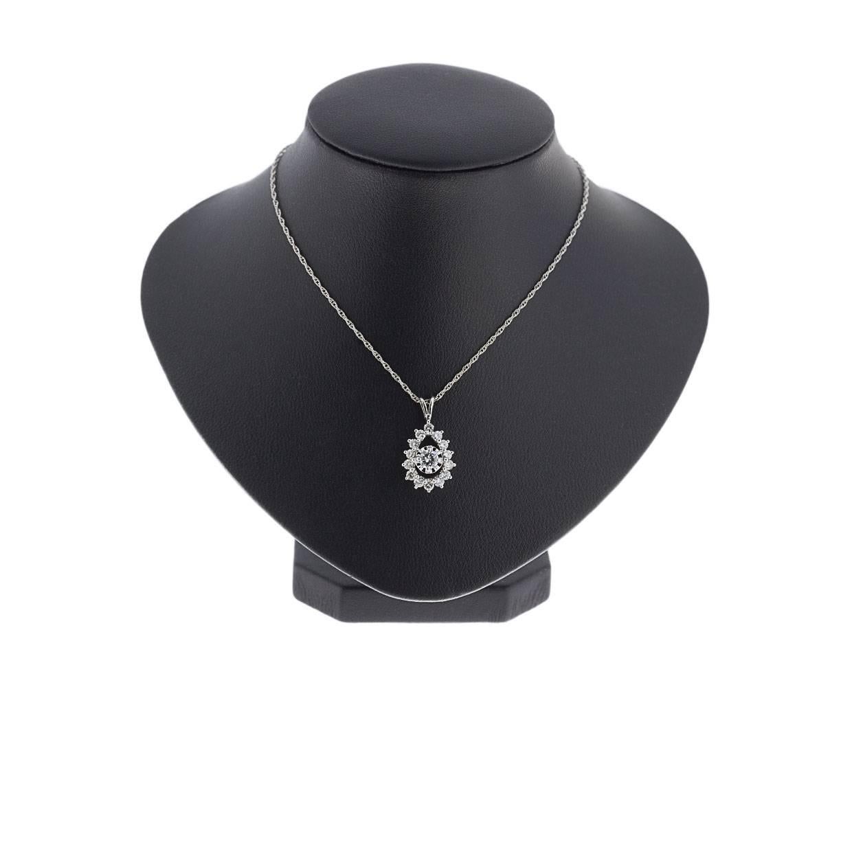 Simple yet elegant & beautiful would be the best way to describe this stunning 14K white gold pendant! It features a round diamond surrounded by a pear-shaped halo. The sparkly round brilliant diamonds weigh .75CTW. The pendant is attached to a 14