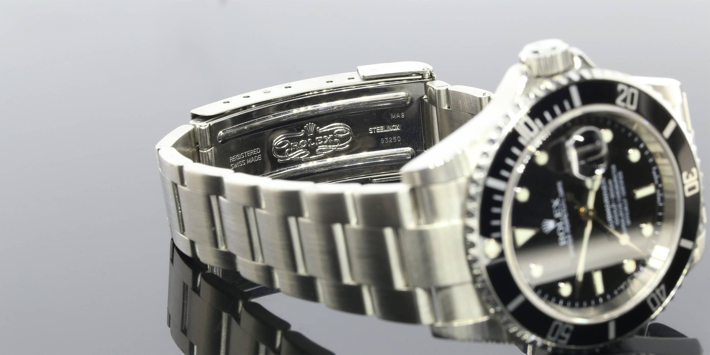 The Rolex is a 2005 model Submariner. The timepiece is comprised of stainless steel and features a black enamel inlay bezel. The Rolex features a Oyster style bracelet, which is in great condition. The timepiece was just cleaned and serviced, which