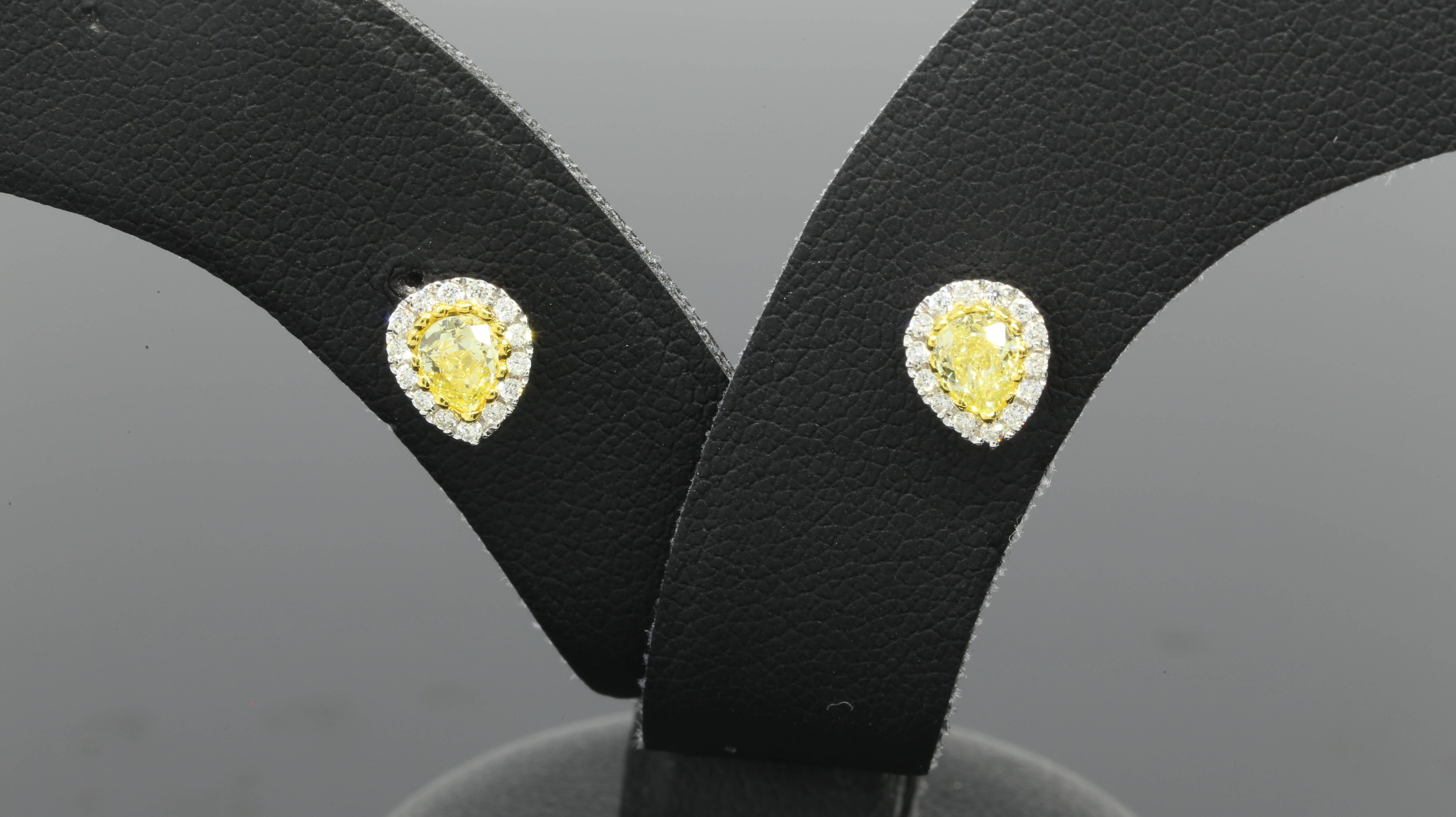 These sparkly earrings feature two pear brilliant cut, canary diamonds weighing in total 0.56ctw. The earrings also feature round brilliant cut, white diamonds weighing in total 0.15ctw, giving the complete earrings a combined total weight of .71