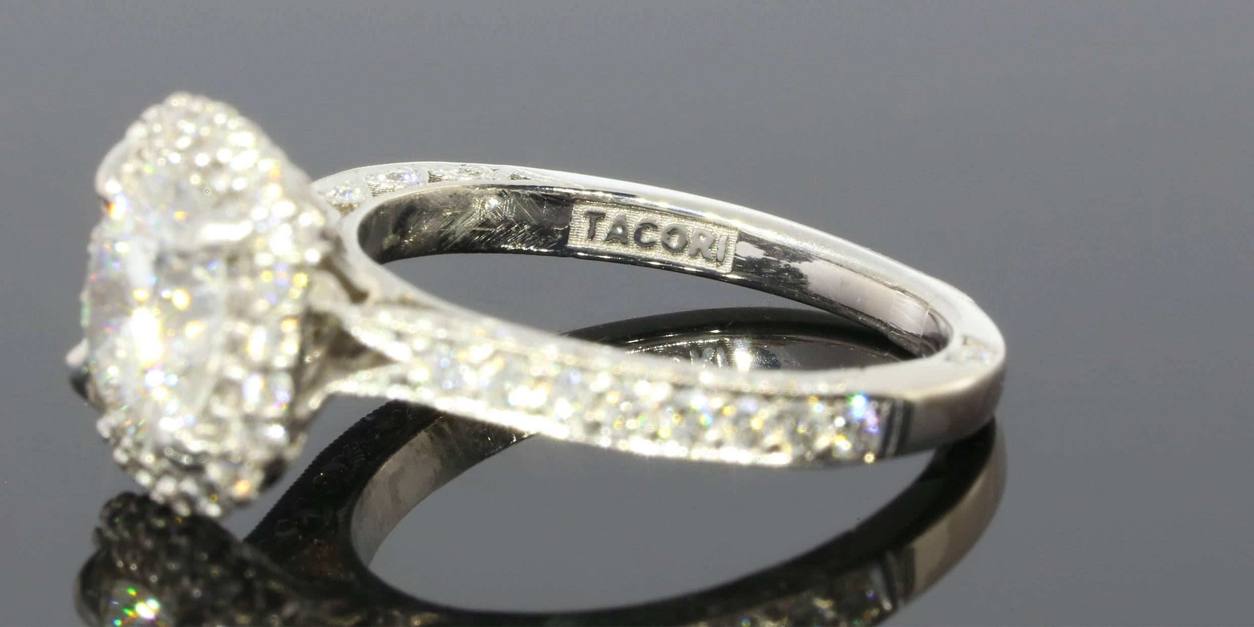 This amazing ring features one modified round brilliant cut Star 129 center diamond weighing 1.35 carats. The diamond is GIA certified bearing the lab report 17546817 and inscription STAR129-40511. The specialty cut of this diamond makes it dance