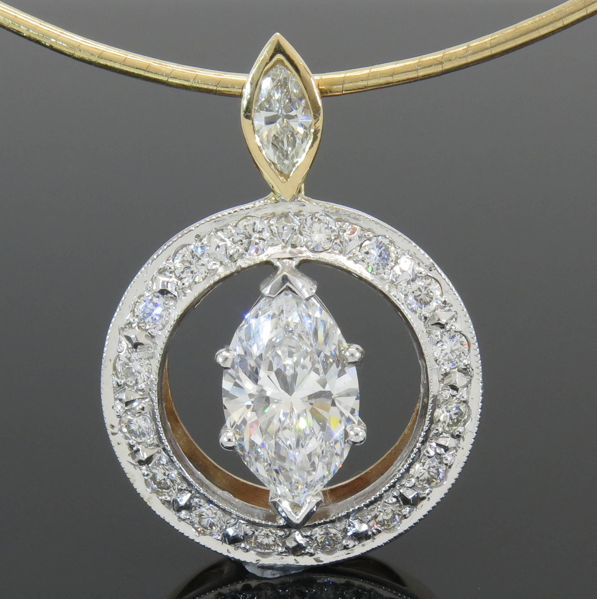 This one of a kind pendant features a stunning 2.01CT marquise center diamond, F-G/SI1 in quality. The pendant also features 16 round brilliant cut diamonds and one smaller marquise weighing 0.70 carats. The diamonds are set in a circle style. The