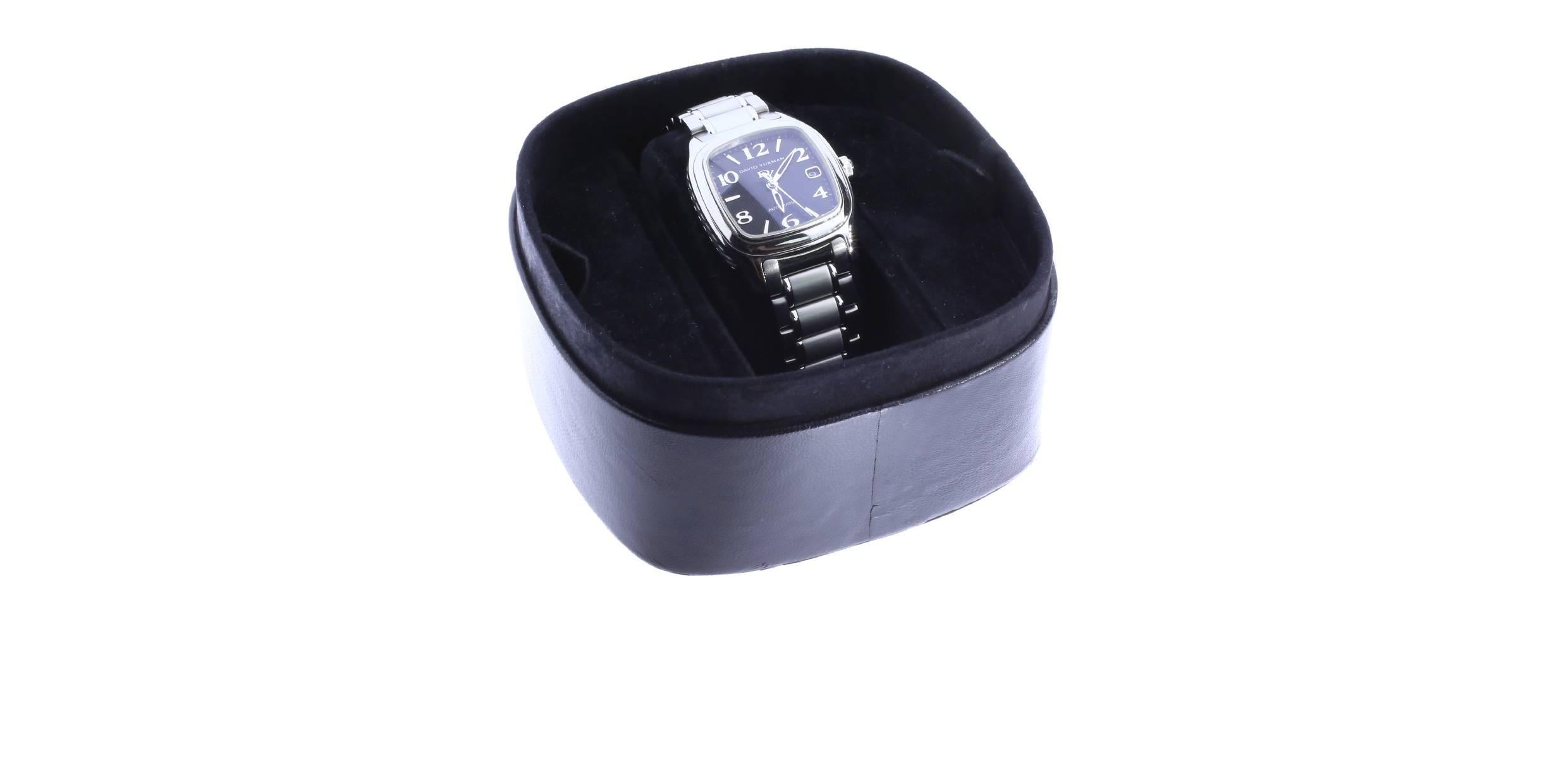 This David Yurman watch is comprised of stainless steel and sterling silver. The watch features a black stick cushion shaped dial with the date, cabochon crown and cable accent sides. The bracelet is polished and satin finish. The watch features an