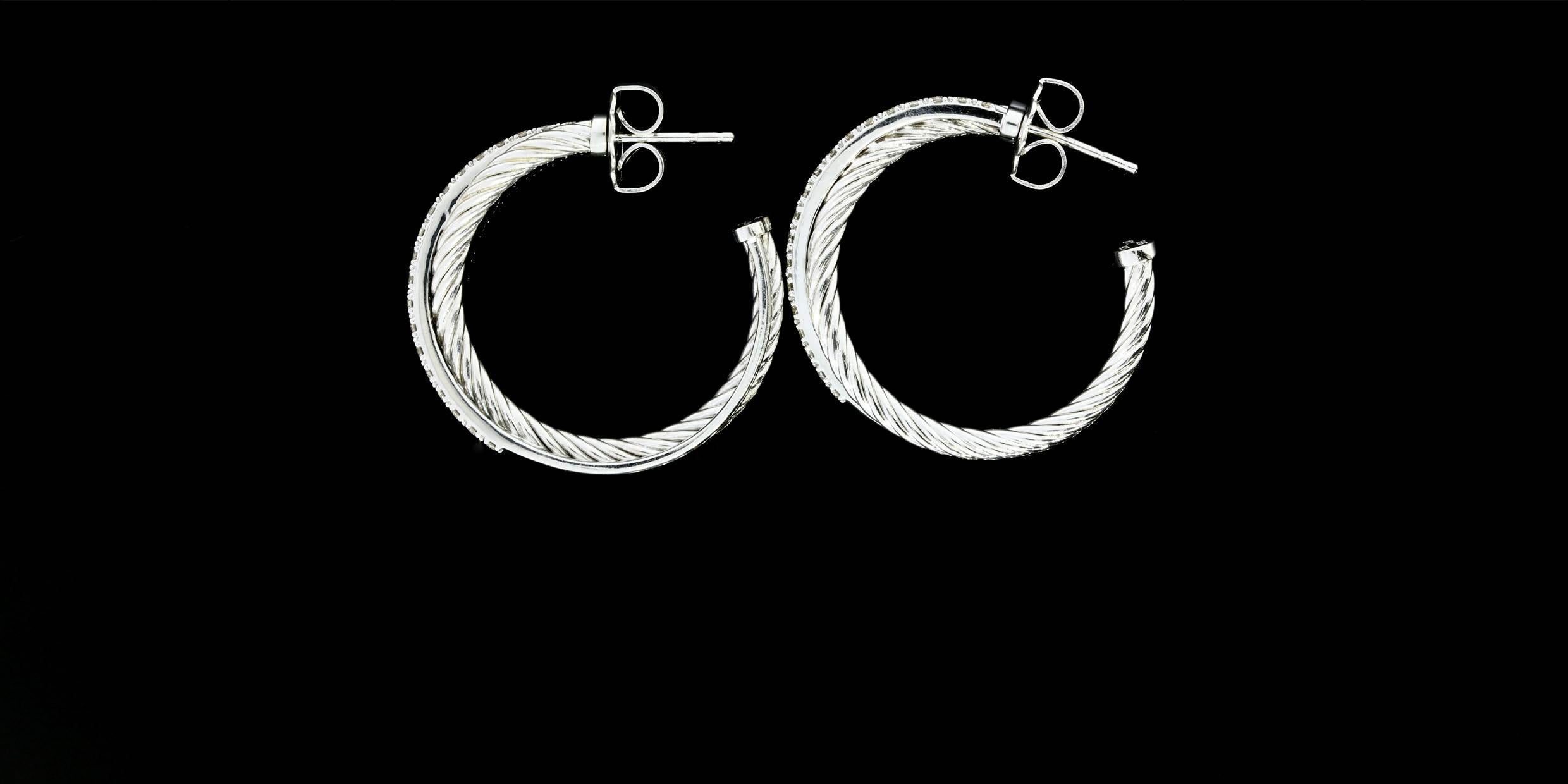 These timeless David Yurman hoop earrings feature 38 round brilliant cut diamonds weighing 0.57 carats in total. The diamonds are I/J-SI1 in quality. The diamonds are prong set in a 