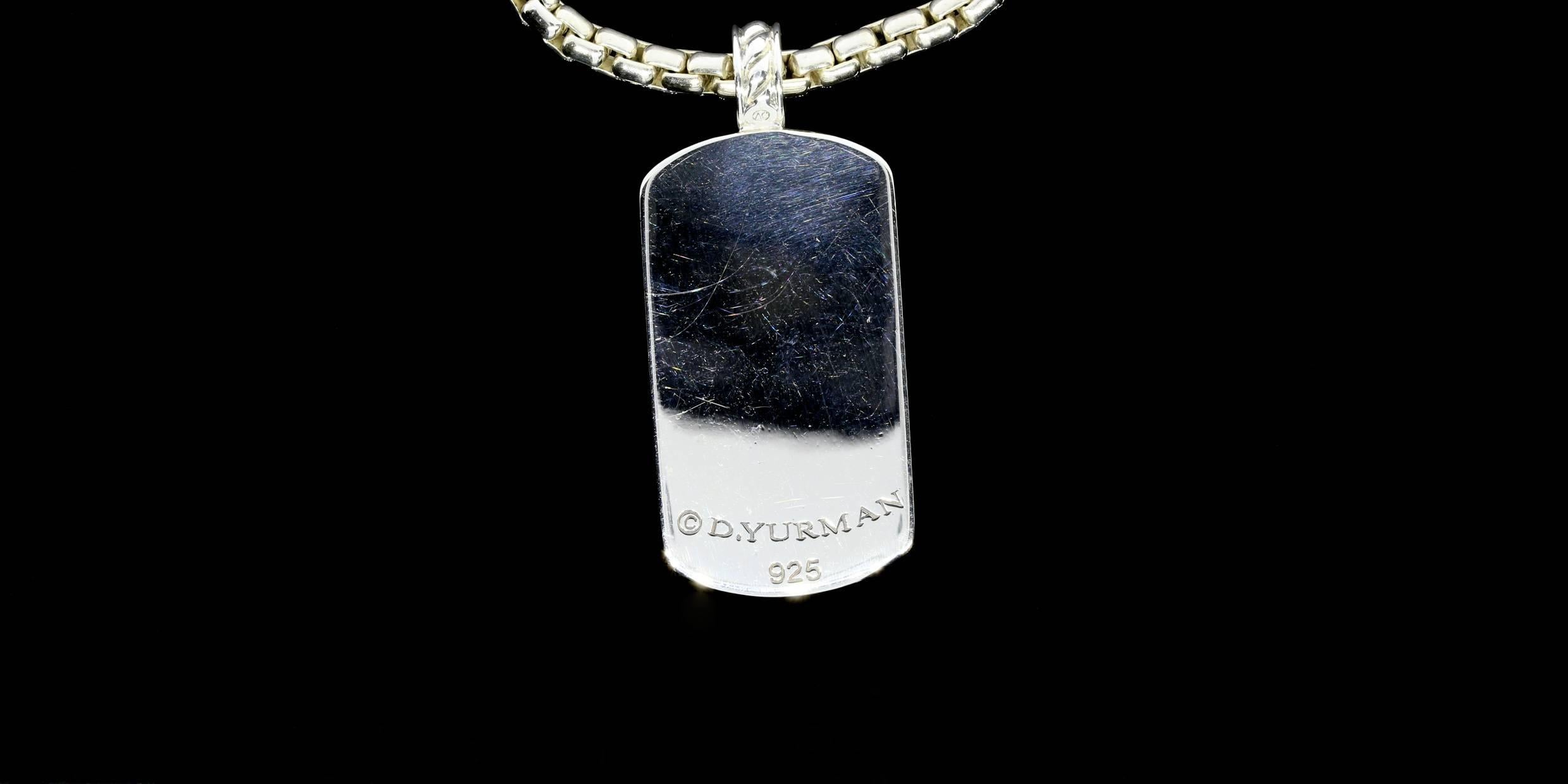 This David Yurman pendant features round brilliant cut diamonds weighing in total approximately 2.25 carats. The diamonds are I/SI1 in quality. The dog-tag is comprised of sterling silver and features a 21 inch substantial cable/box chain. The
