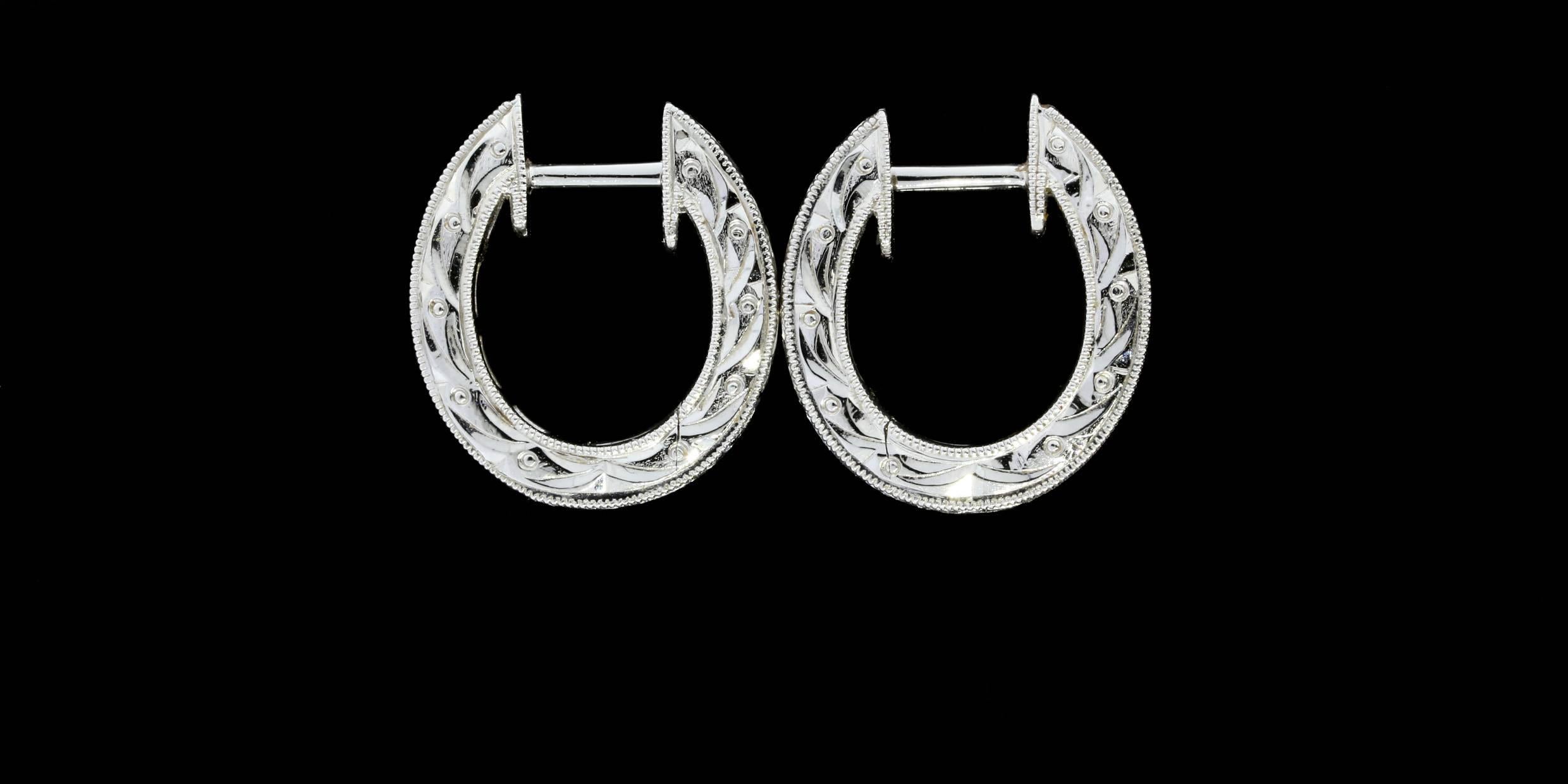 The earrings features 20 round brilliant cut diamonds weighing in total 0.50 carats. The diamonds are G/SI1+ in quality. The diamonds are channel set in these gorgeous small huggie style hoops. The earrings are comprised of 18 karat white gold and