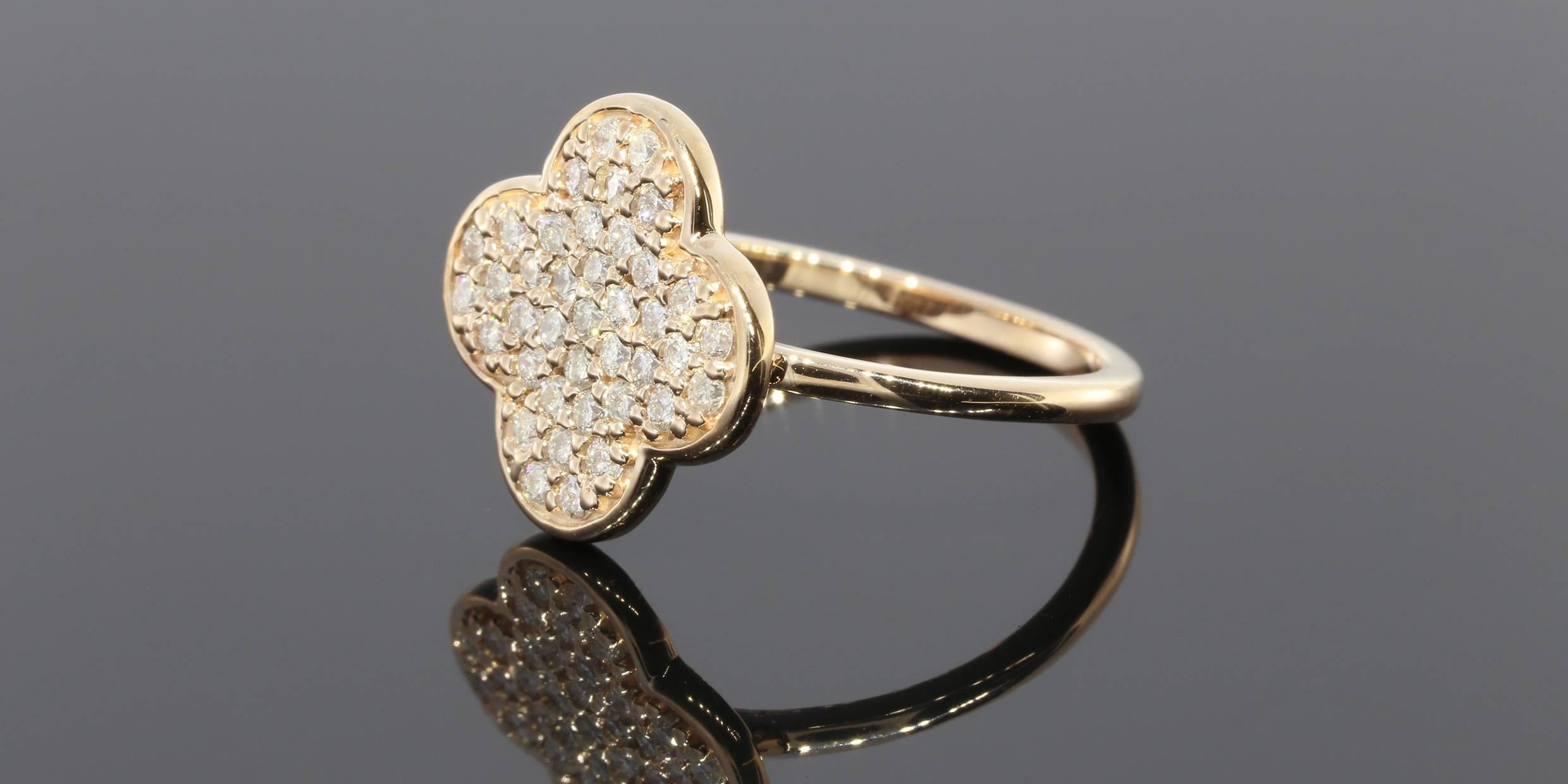 This lovely ring features a beautiful clover design in trendy rose gold. The ring is pave set with sparkly round brilliant cut diamonds that have a combined total weight of .35 carat & grade as GH/SI in quality. The ring is comprised of 14 karat