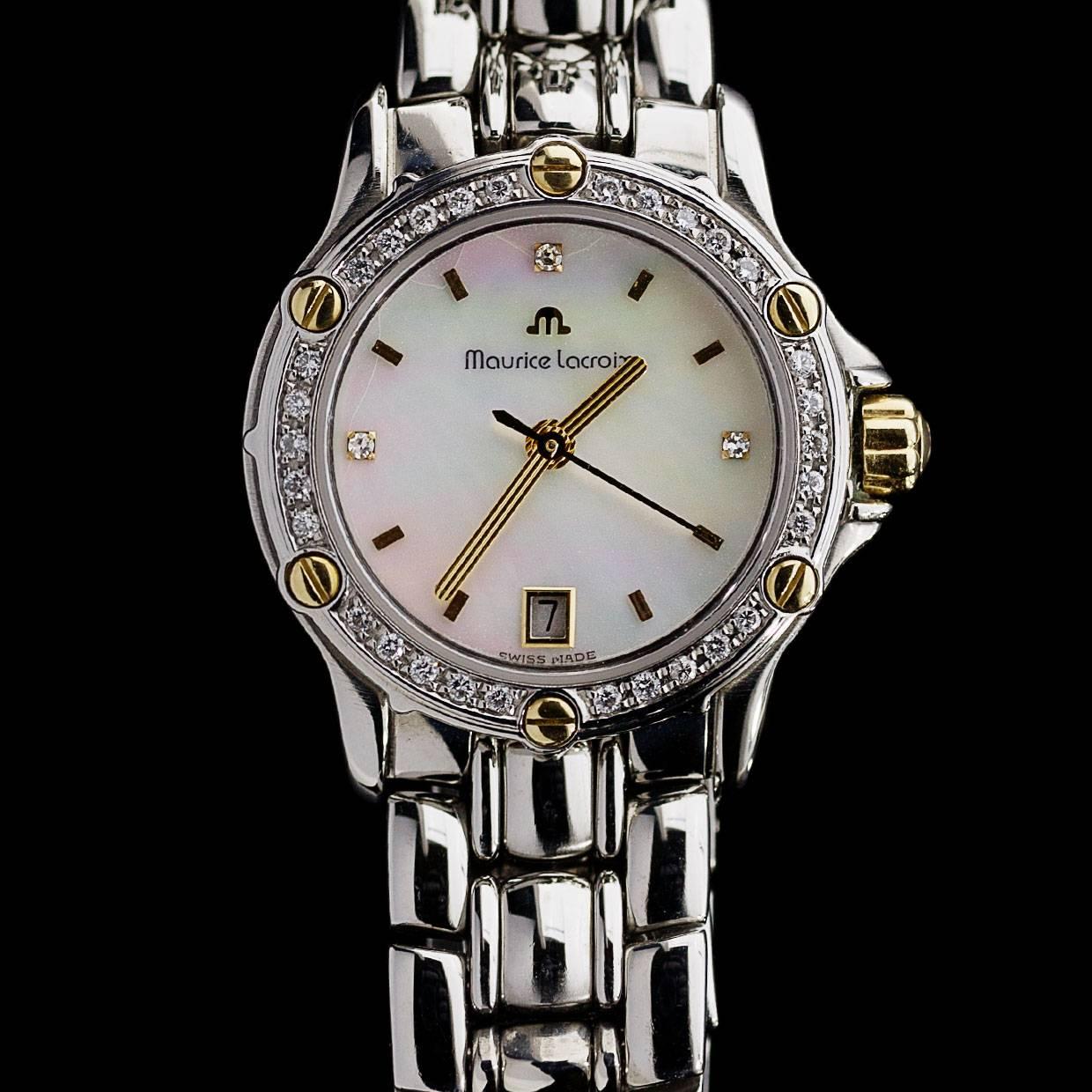 This is a beautiful stainless steel and 18K yellow gold Maurice Lacroix watch from the Tiago collection. Thirty-three glittering diamonds are set in the bezel and dial of this elegant timepiece. The watch also features 18 karat yellow gold screws,