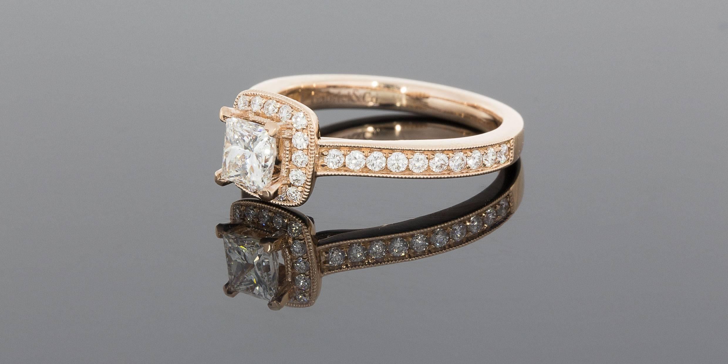 This absolutely stunning halo engagement ring is from the designer Gabriel & Co. It is a part of their Victorian Collection & features 1.0 carat total weight in sparkly, brilliant, high quality diamonds. The center diamond is a 0.60 carat
