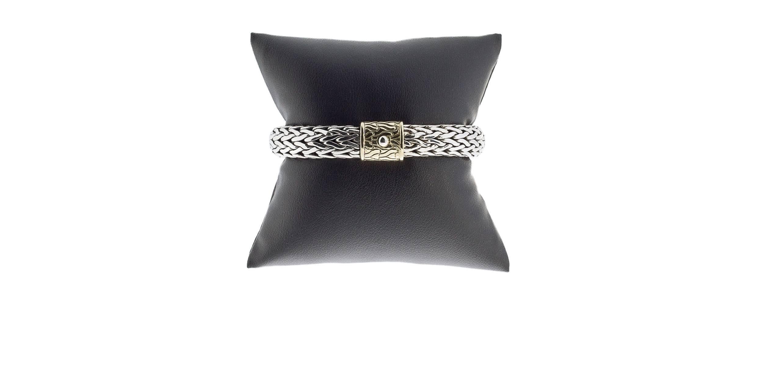 Each piece of John Hardy jewelry has been hand crafted in Bali since 1975. John Hardy is dedicated to creating timeless one-of-a-kind pieces that are brilliantly alive. This beautiful bracelet features a woven design in sterling silver with an