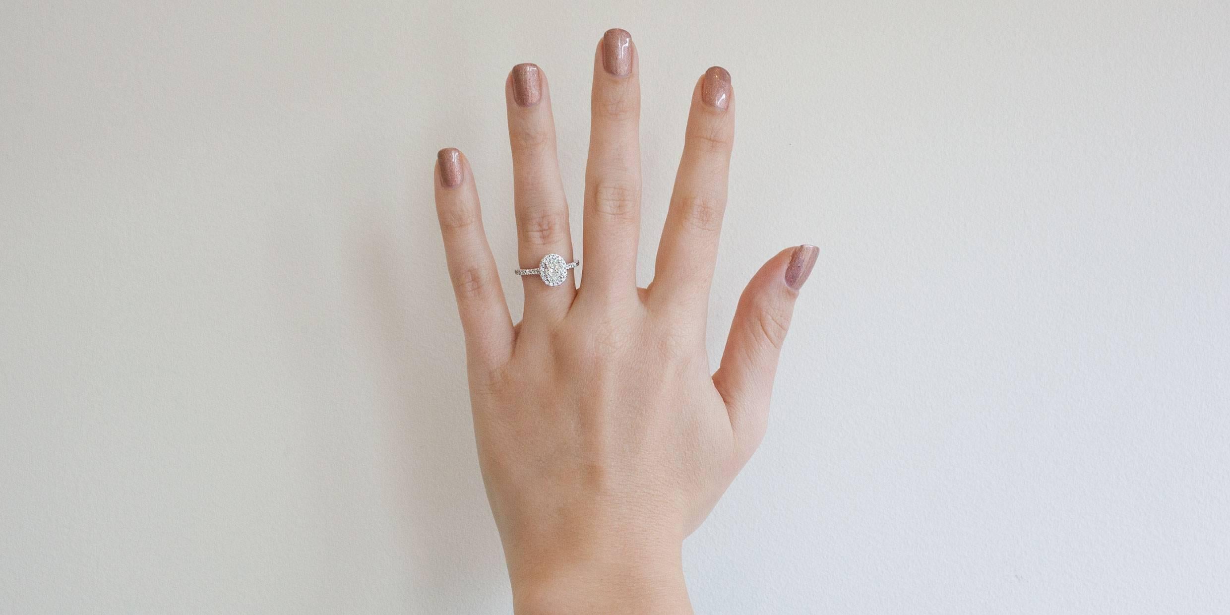 .75 carat diamond ring on finger