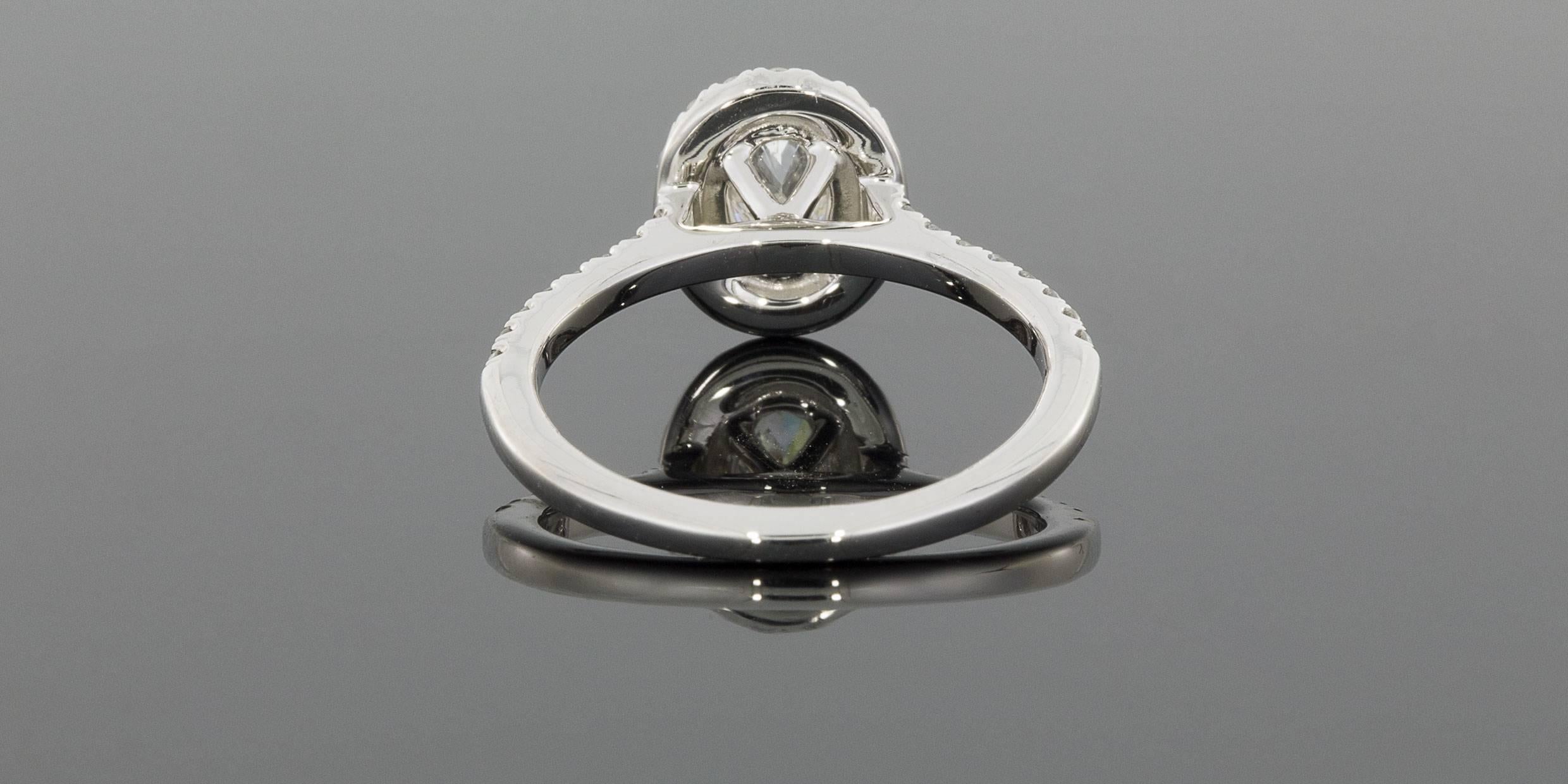 .75 carat oval diamond ring on finger