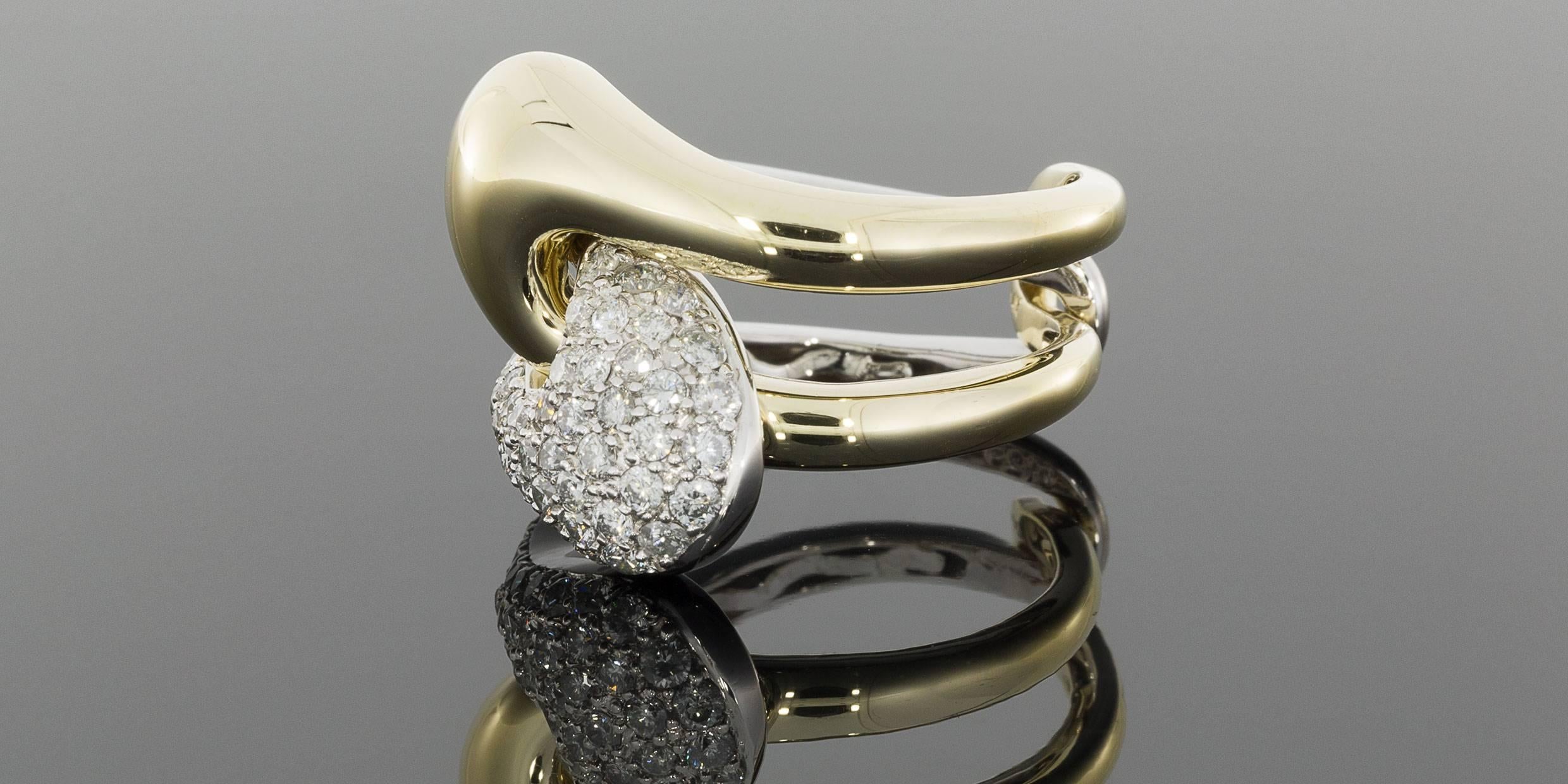 This amazing ring is sparkly, beautiful, & quite unique! It is a 2-piece, interlocking puzzle ring featuring 1 carat total weight in pave set round diamonds. The 2 pieces fit together by placing them back to back, interlocking the shanks, &