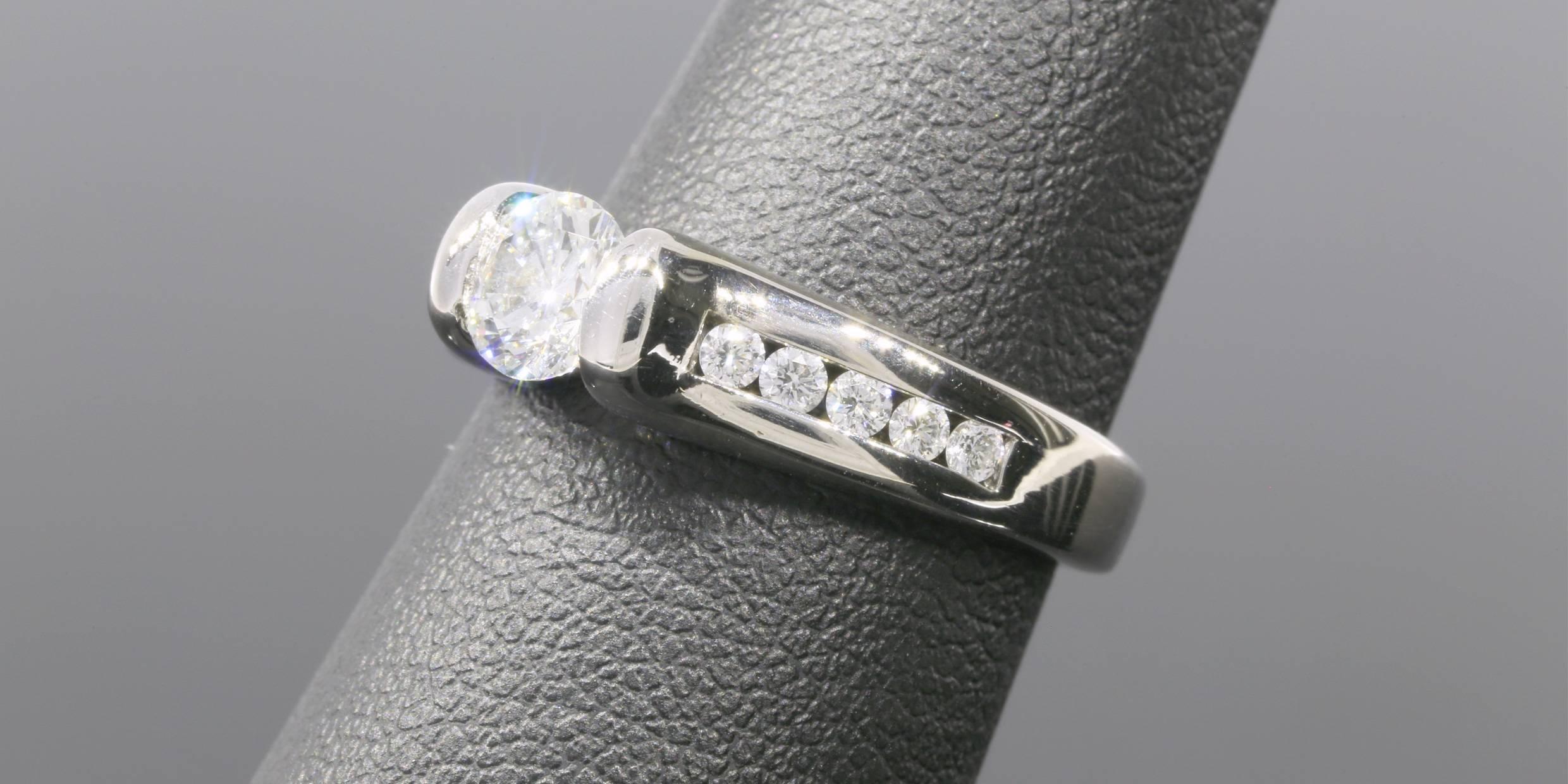 Sleek White Gold 1 Carat Round Diamond Classic Channel Set Engagement Ring In Excellent Condition In Columbia, MO