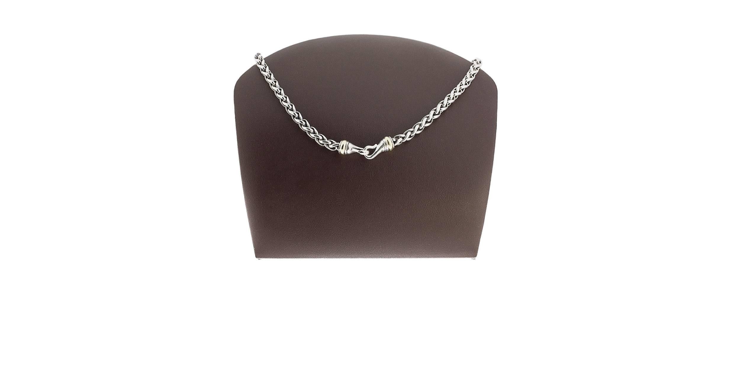 This beautiful necklace is from David Yurman, a legend in the jewelry business. This versatile, wheat chain is comprised of sterling silver with 14 karat yellow gold accents. It is 16
