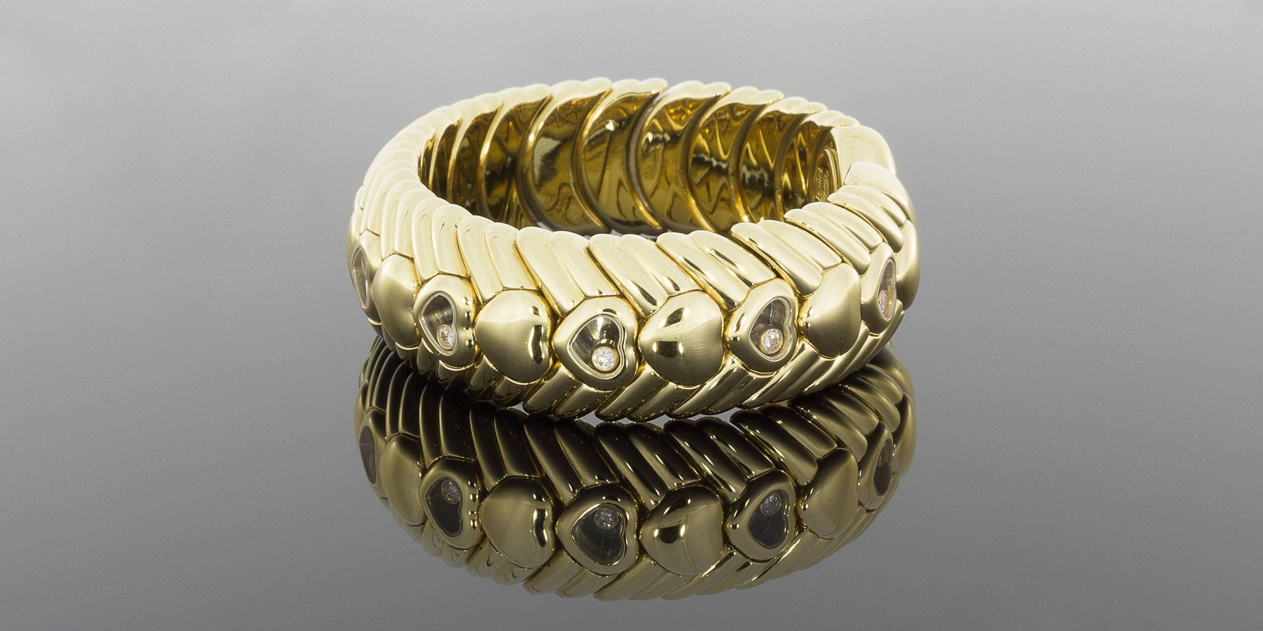 Rare Chopard 18 Karat Yellow Gold Happy Diamonds Heart Flex Bangle Bracelet In Excellent Condition For Sale In Columbia, MO