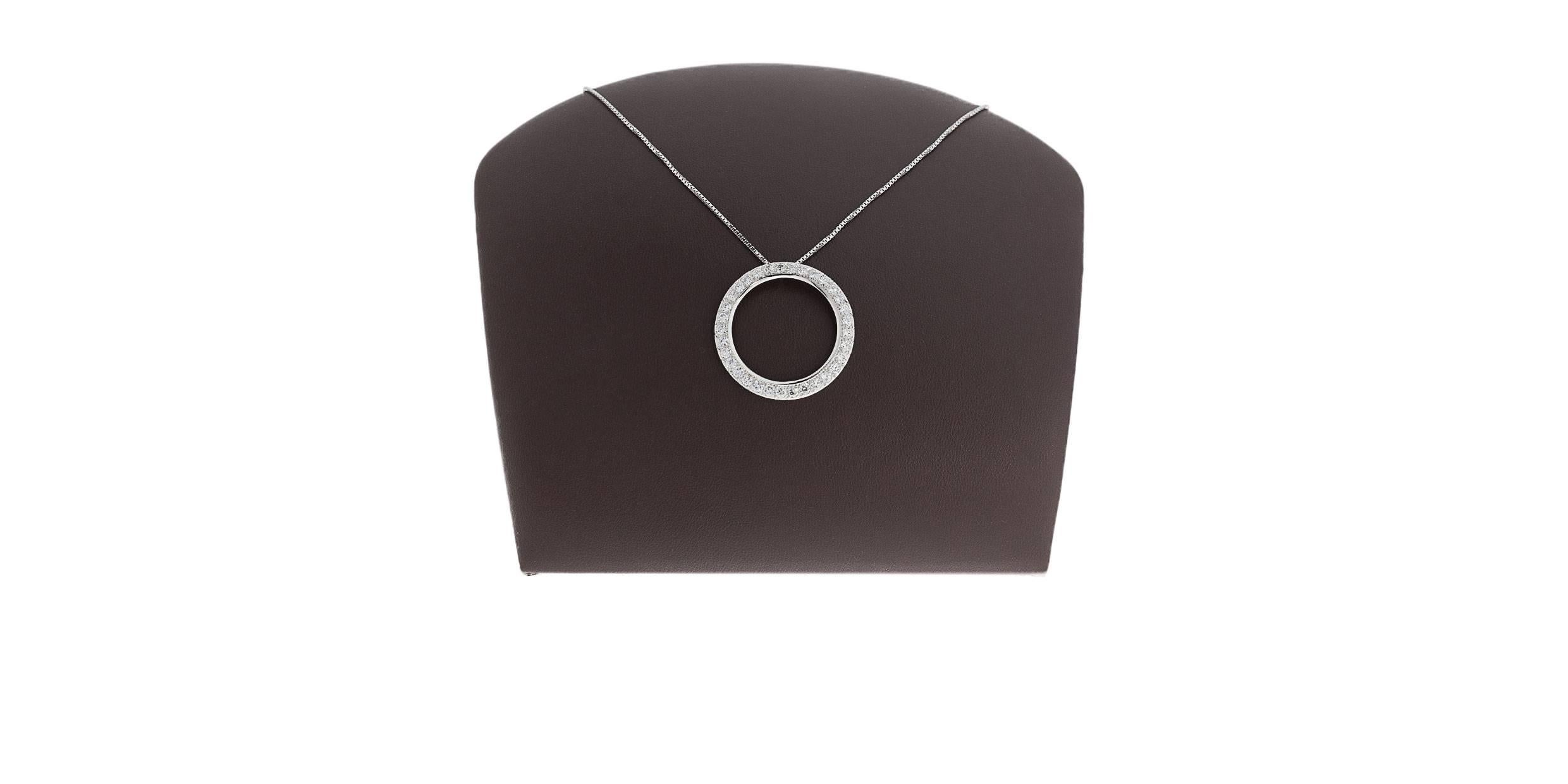 This simple yet elegant necklace features a platinum circle pendant that is channel set with round brilliant cut diamonds. These beautiful & sparkly diamonds have a combined total weight of 3.40 carats and grade as G/VS in quality. The pendant