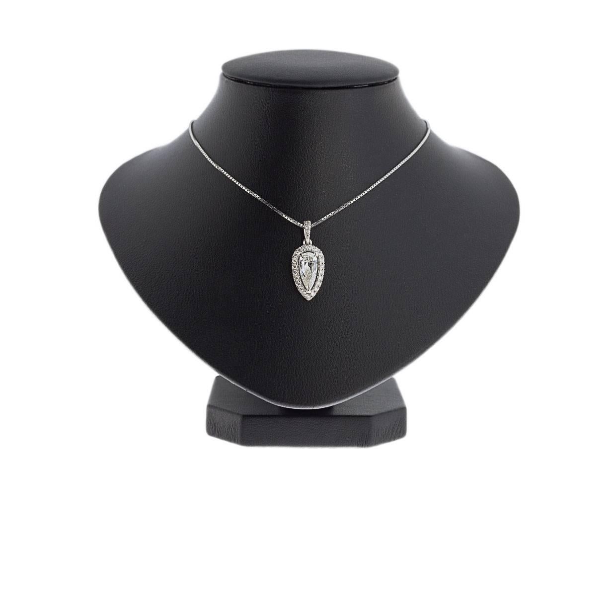 Simple yet elegant & beautiful would be the best way to describe this stunning necklace! It features a 1.05 carat, elongated pear brilliant cut, natural diamond that is prong set. This pendant was custom made for this diamond, featuring .28
