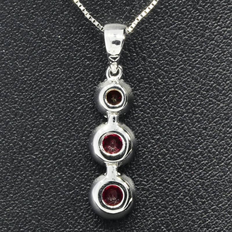 White Gold Ruby and Diamond Three Stone Halo Pendant Necklace In New Condition In Columbia, MO