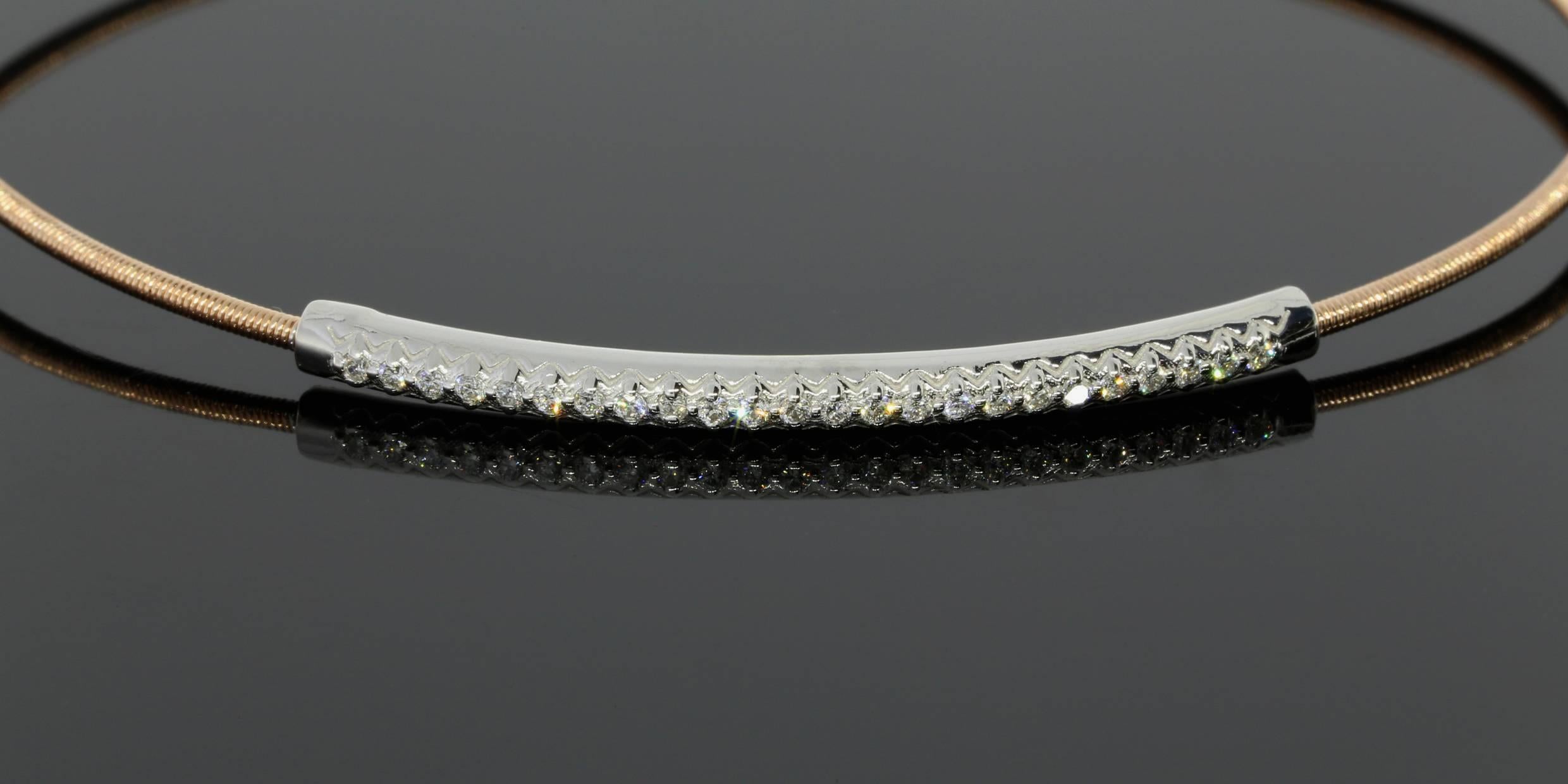 This beautiful diamond bracelet is perfect to add an unassuming sparkly touch to your wardrobe. The center of the bracelet is a solid 14 karat white gold curved bar that is prong set with round brilliant diamonds. These diamonds have a combined