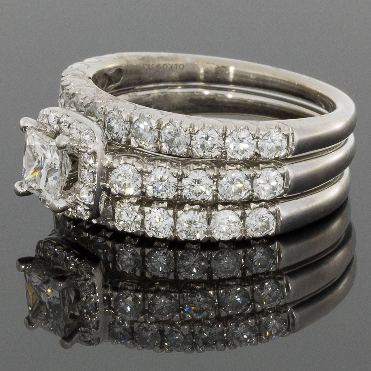 This gorgeous diamond engagement ring ring revolves around the stunning Tolkowsky Princess Ideal Cut diamond in the center. Prong set diamonds decorate the sides of the center diamond and continue down the side of the white gold band to add