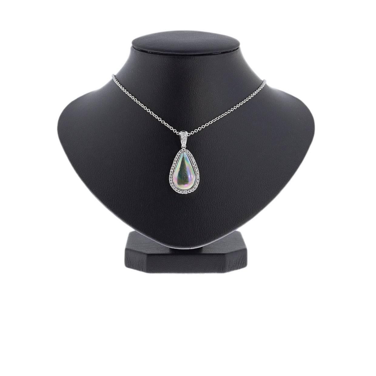 Simple yet elegant & beautiful would be the best way to describe this stunning necklace! It features a teardrop shaped, black mabe pearl that is bezel set. This lustrous pearl is surrounded by a halo of sparkly, round brilliant cut diamonds,