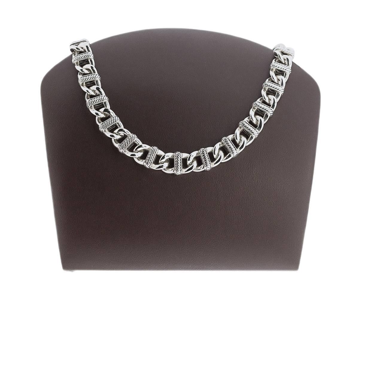 This beautiful David Yurman necklace is from the Madison Collection. It features oval shaped curb links with cable design bars in the centers of each link. This timeless, versatile necklace measures 16