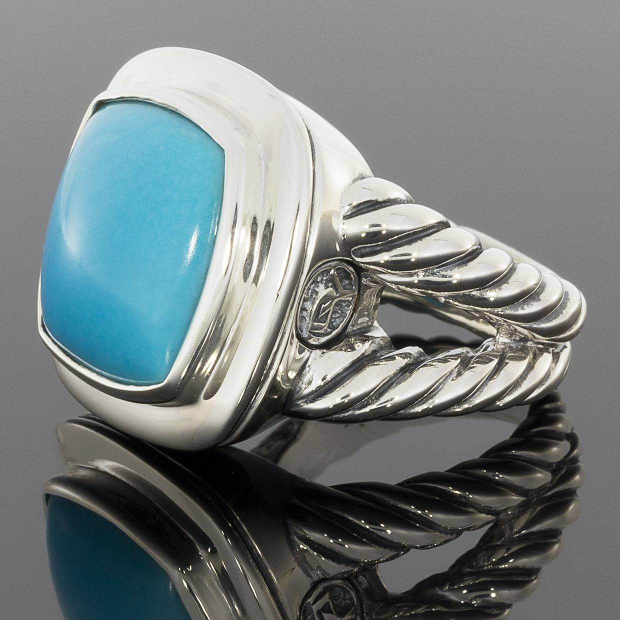 This beautiful David Yurman ring is from the Albion Collection. It features a 14 x 14 millimeter, cabochon, cushion cut turquoise that is bezel set. The ring is comprised of sterling silver. The bezel is smooth, & the ring's split shank features