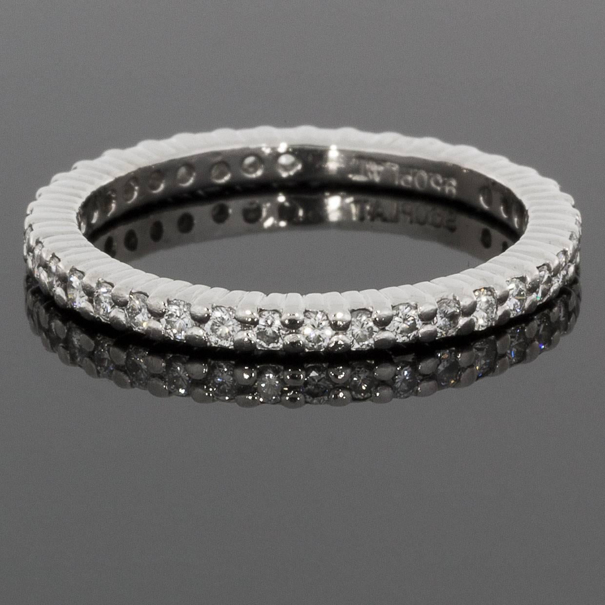 This beautiful, high quality band is a timeless platinum round diamond eternity band that can dress up any ring. It can be used as a wedding band, stand alone band, or stack ring. The ring has 38 round brilliant cut diamonds that have a combined