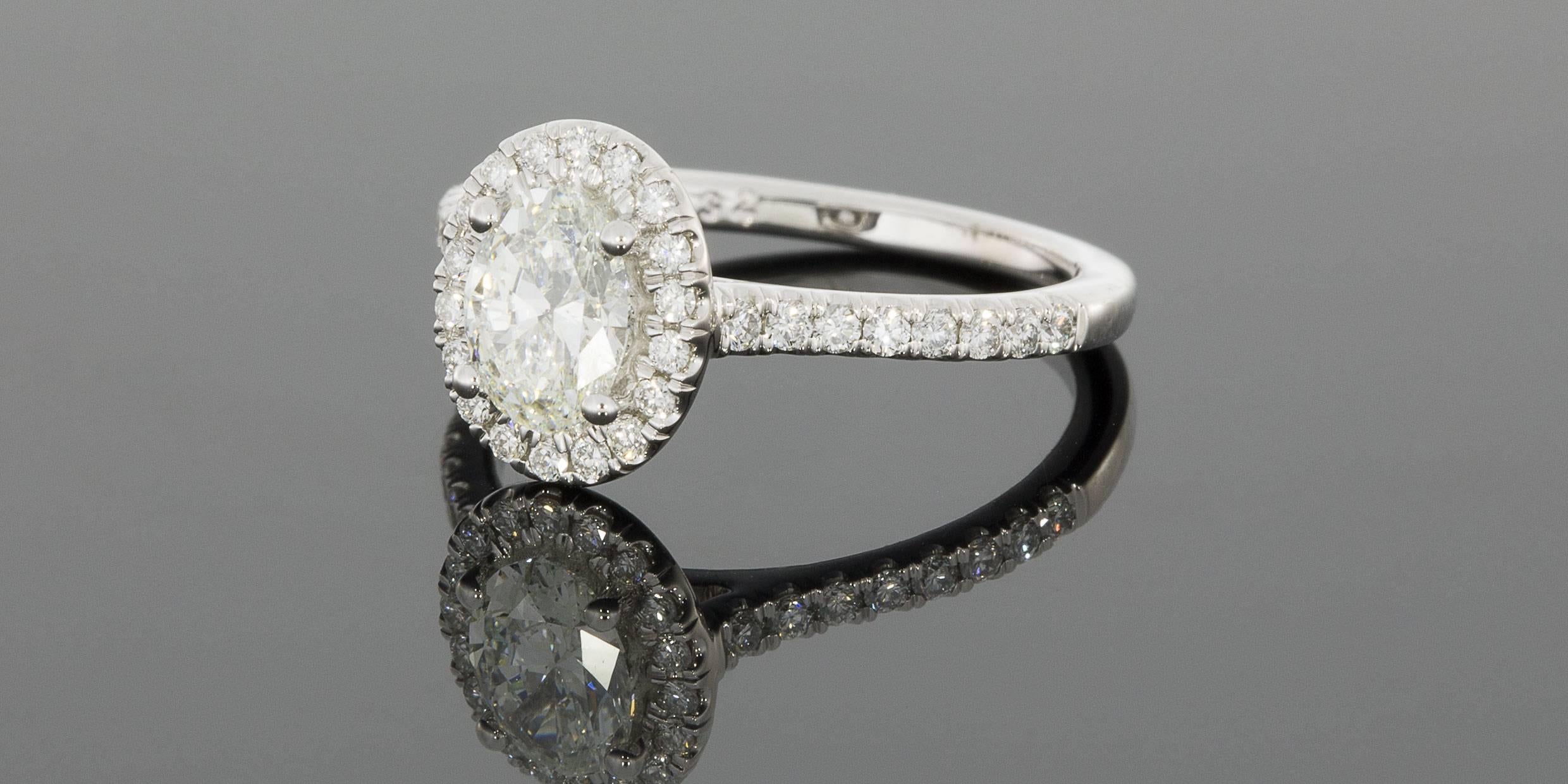 This gorgeous diamond halo engagement ring is from the designer Martin Flyer. This 65 year old, third generation family owned business handcrafts all their rings with extraordinary attention to detail, using only the highest quality, Hearts &