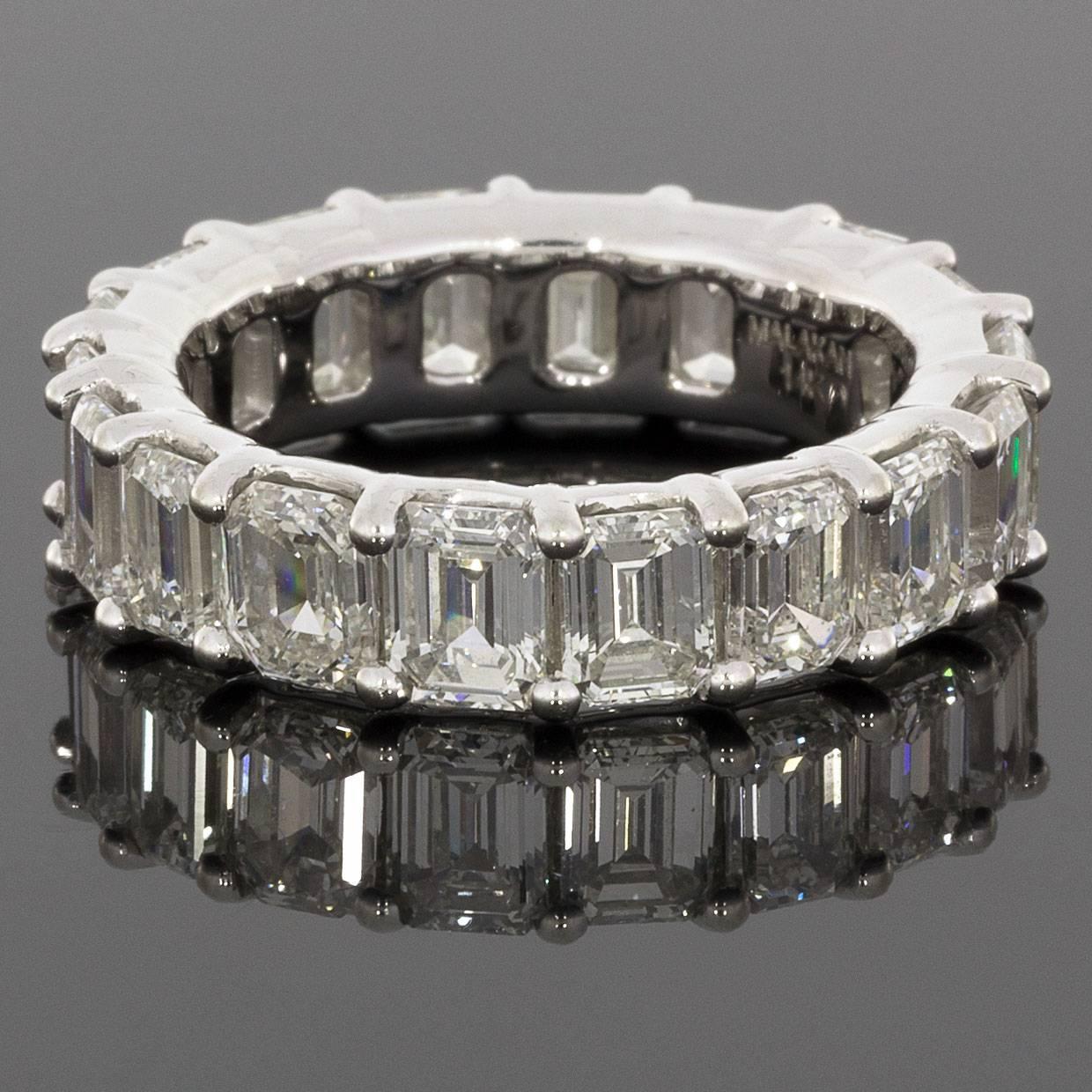 This absolutely stunning band is a classic prong set, diamond eternity band featuring 18 beautiful emerald cut diamonds. Trading the sparkle and fire of a traditional brilliant-cut stone, emerald cut diamonds instead offer a dramatic hall-of-mirrors