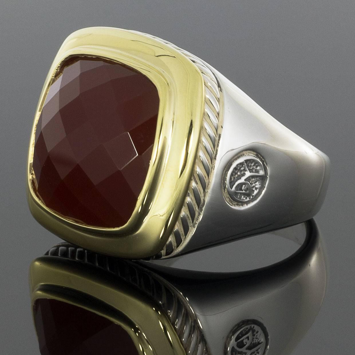 This beautiful David Yurman ring is from the Albion Collection and features a checkerboard faceted cushion cut carnelian gemstone.  The center stone is 15 x 15 mm.The ring is made of sterling silver and 18 karat yellow gold with a high polished