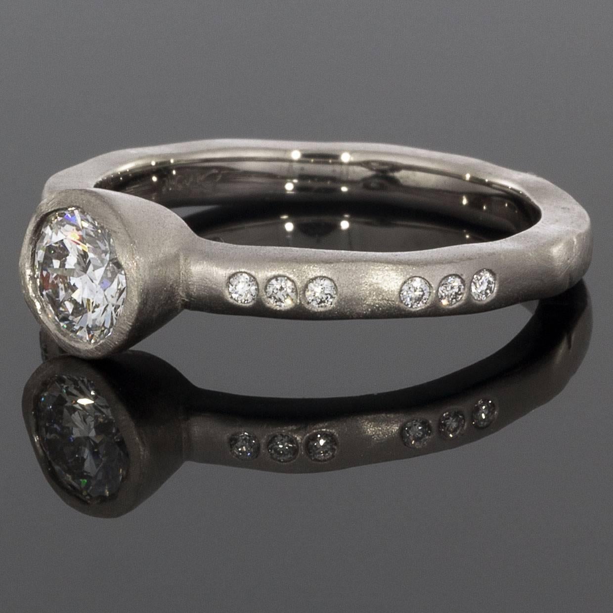 Take her breath away with this spectacular 0.59ctw diamond ring from Martin Flyer! This 65 year old, third generation family owned business handcrafts all their rings with extraordinary attention to detail. This beautiful Martin Flyer ring is from