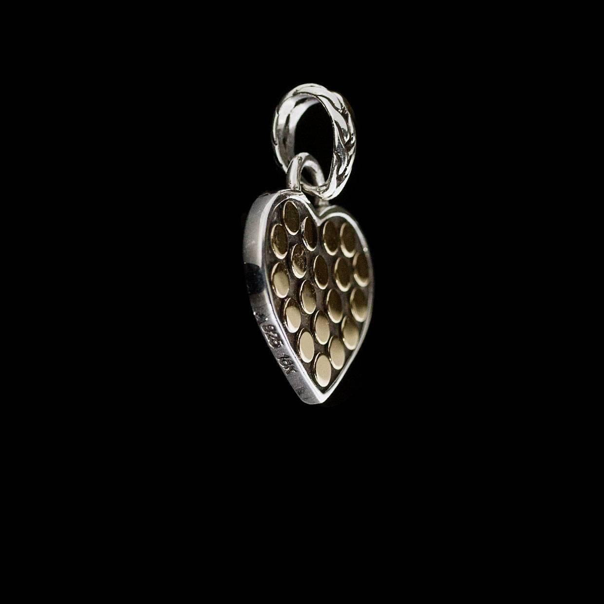 Each piece of John Hardy jewelry has been crafted in Bali since 1975. John Hardy is dedicated to creating timeless one-of-a-kind pieces that are brilliantly alive.

This sterling silver pendant is retired from John Hardy's Jaisalmer Dot collection.