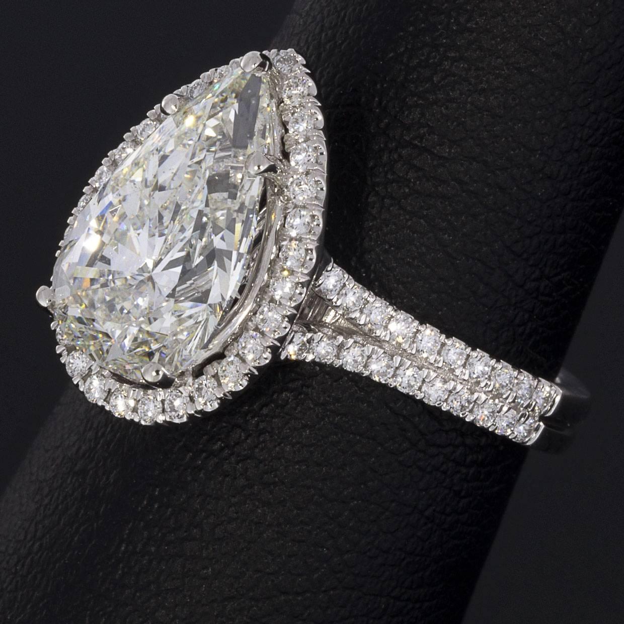 3.96 Carat Platinum Certified Pear Diamond Halo Engagement Ring For Sale 1