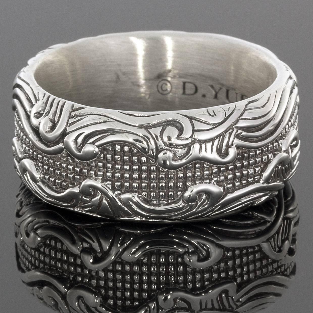 David Yurman's cable style jewelry has become his signature, the unifying element of every collection. This timeless David Yurman men's ring is from the Waves Collection & features Yurman's intricate sterling silver designs. The ring measures 10