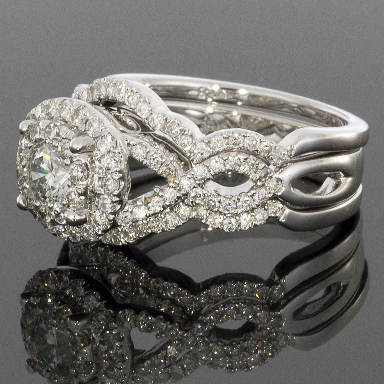 Item Details:
Estimated Retail - $5,000.00
Brand - Helzberg
Metal - 14 Karat White Gold
Total Carat Weight (TCW) - 1.65 ctw
Style - Halo Engagement Ring with 2 Bands
Ring Size - 7.00
Sizable - Yes
Width - 3.60 mm

Stone 1 Information: (Engagement
