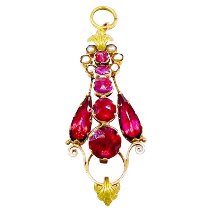 Antique Russian rare find 18k gold garnet pendant flanked with seed pearls garnet messurments 10.75mm/7.45mm/4.65mm/4.30mm and pendant length 5cm in 18k gold finest setting with magnificent workmanship hall marked 72 imperial Russian gold standard