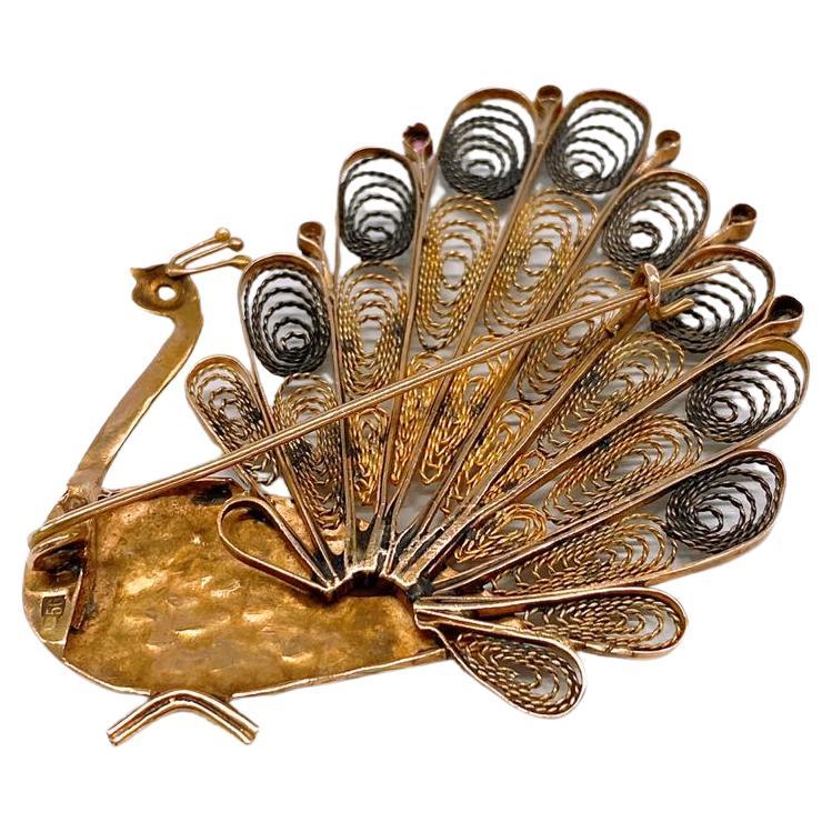 antique peacock brooch