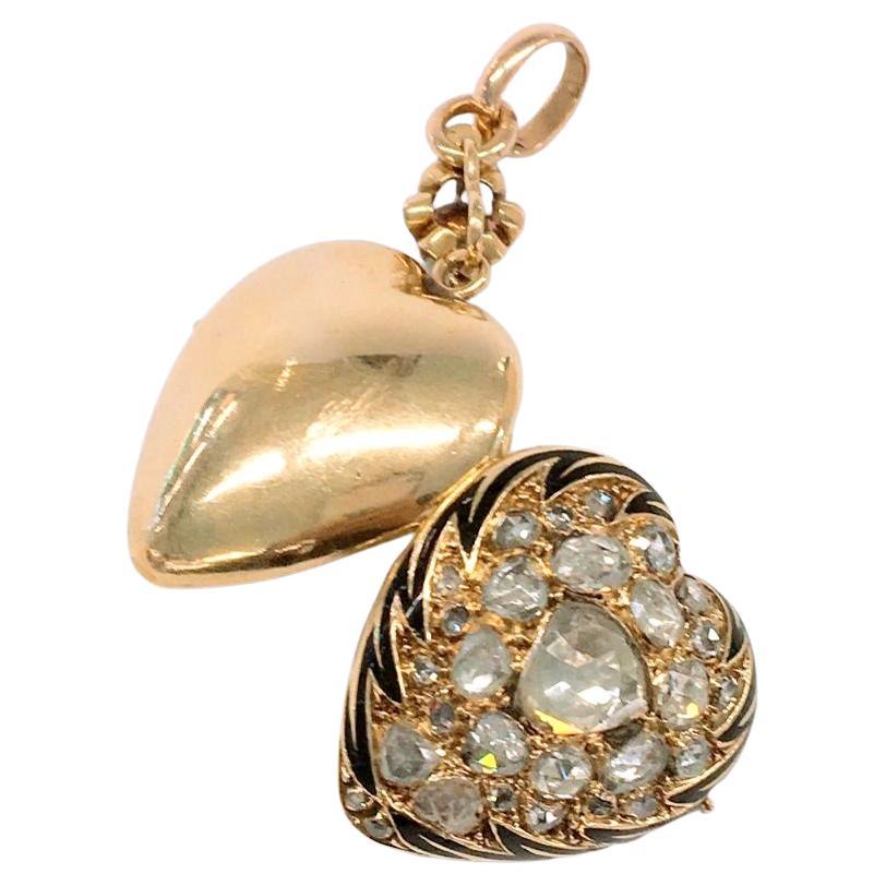 Antique rose cut diamond heart locket pendant with an estimate diamond weight of 4 carats decorated with black enamel total pendant length 4cm dates back to the astro hungarian era 1880.c