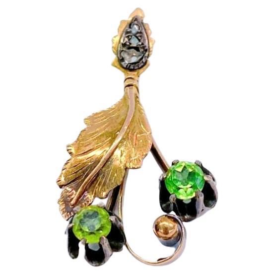 Antique Russian pendant in leaf design decorated with 2 green demantoid stones and rose cut diamonds 4cm length with magnificent workmanship hall marked 56 imperial Russian gold standard and Moscow assay mark and assayer master intial in cyrillic