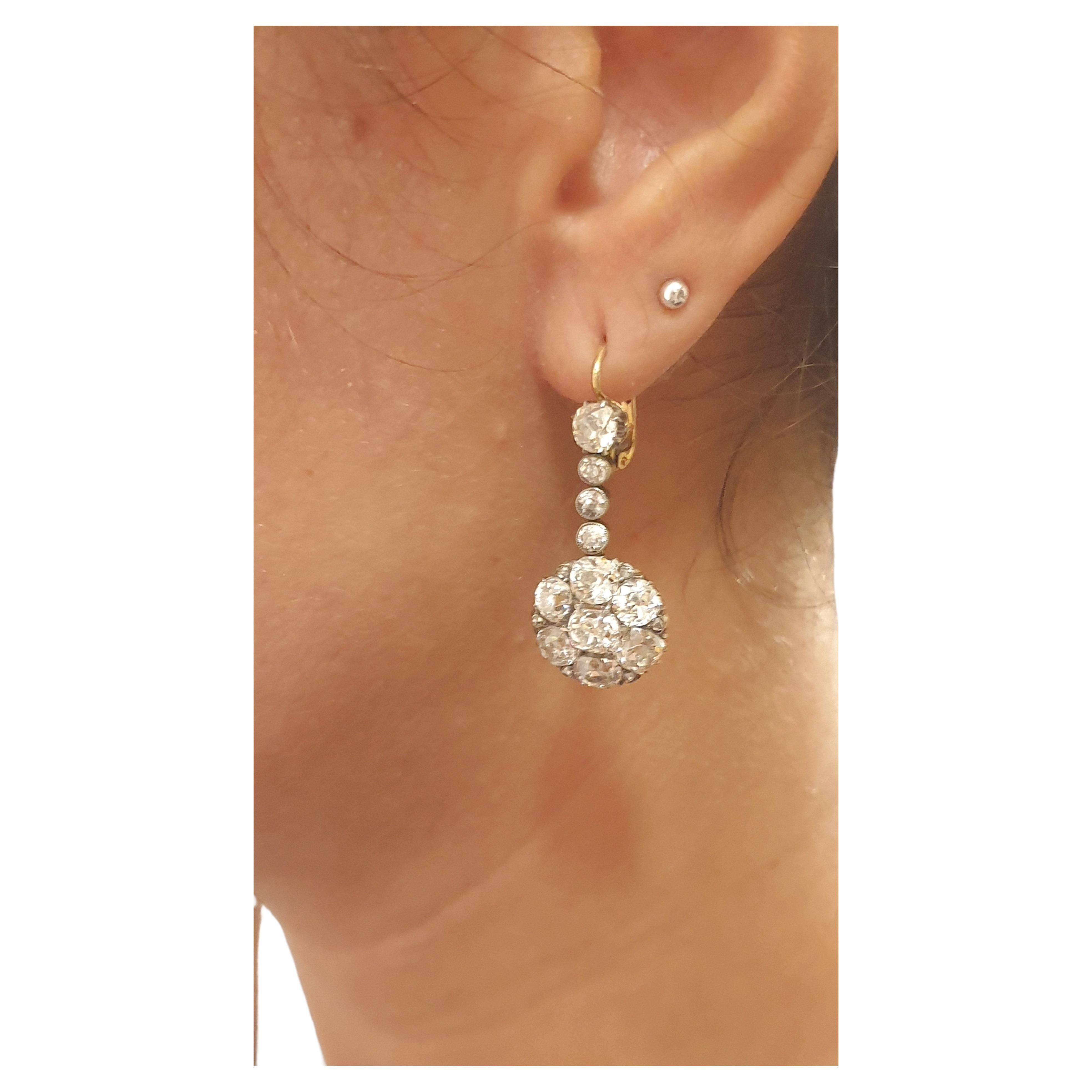 Antique large old mine cut diamond cluster earrings with large diamonds estimate weight of 7 carats H color white excellent spark earrings length 3.5 cm in white and yellow gold setting earrings head diameter 13.80mm and each stone diameter around